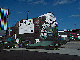 rolling cow billboard, Dodge City, KS