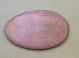 A flattened penny.