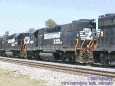 Another trio, this time GP38--2s, with yet another load of coal...