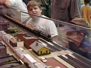 Two young visitors watch the action near the station. 83.8K