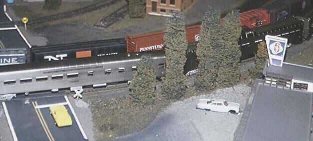 The Super Chief passes a freight in front of Tom's Place. 11K