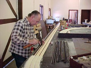 Track being laid on the mainline roadbed. 70.4K