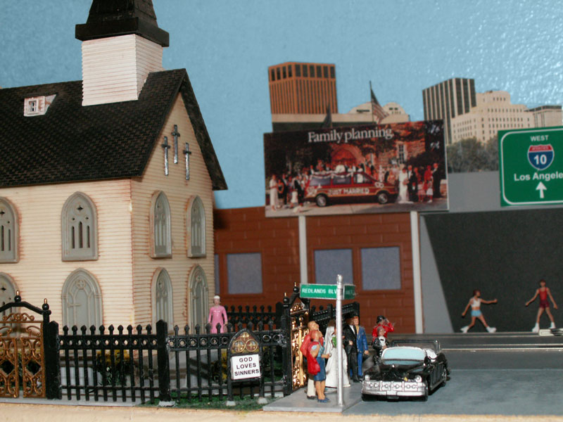 The sign says "God Loves Sinners" (John 3:16 Sermon)