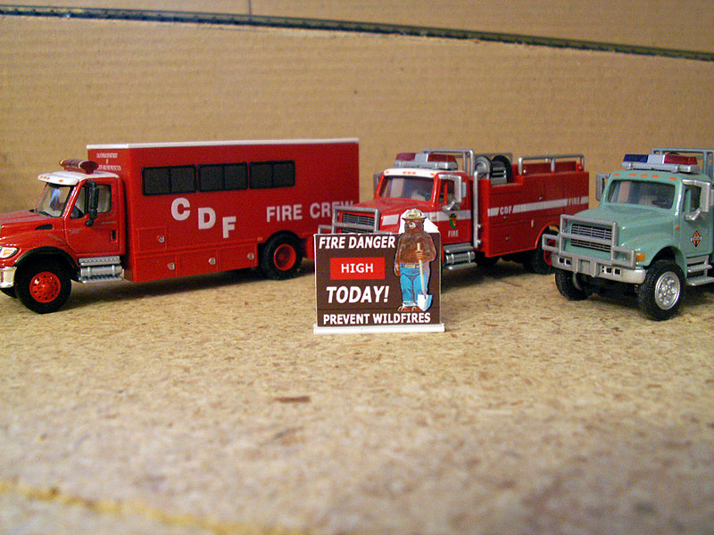 Fire Crews on standby because smokey bear sign says the fire danger is high