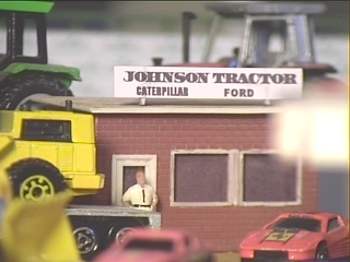 Mr. Johnson stands outside the office