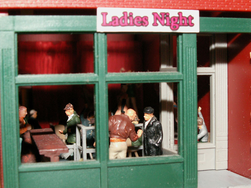 A bouncer checks IDs at the front door of Ladies Night Mens Club