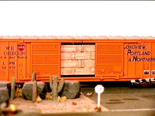 Longview Portland and Northern box car with lumber load