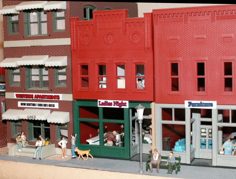 Ladies Night is located between The Westside Story Apartments and the furniture 