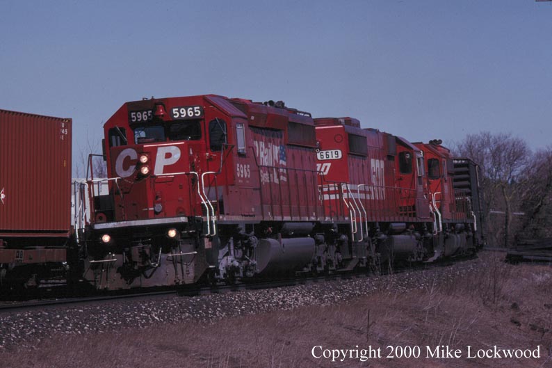 CP 5965, Soo 6619, and CP 56?? at Palgrave Mar.27, 1999