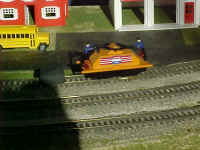 This American Flyer hand car automatically reverses when it bumps the bumper on the track.