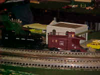 Closeup of New York Central snow plow pushed by a switcher locomotive.