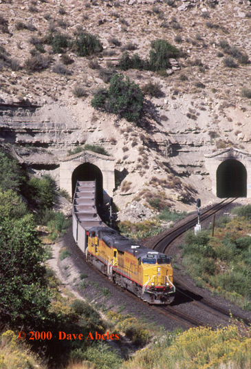 Eastbound UP empties exit the tunnels just east of Kyune,         UT; 08/19/00