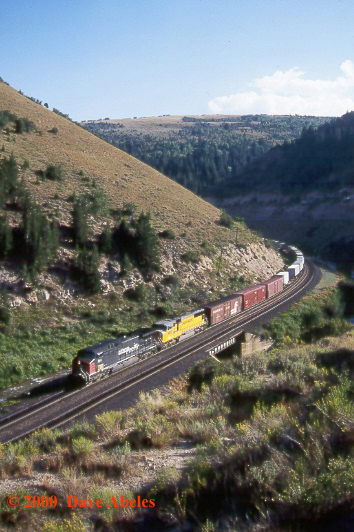 UP train MDVRO (Denver, CO to Roper [Salt Lake City] UT, Manifest) roars upgrade just east of Kyune, UT; 08/19/00