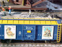 This photo is a a close up view of Norman Rockwell Art boxcars.